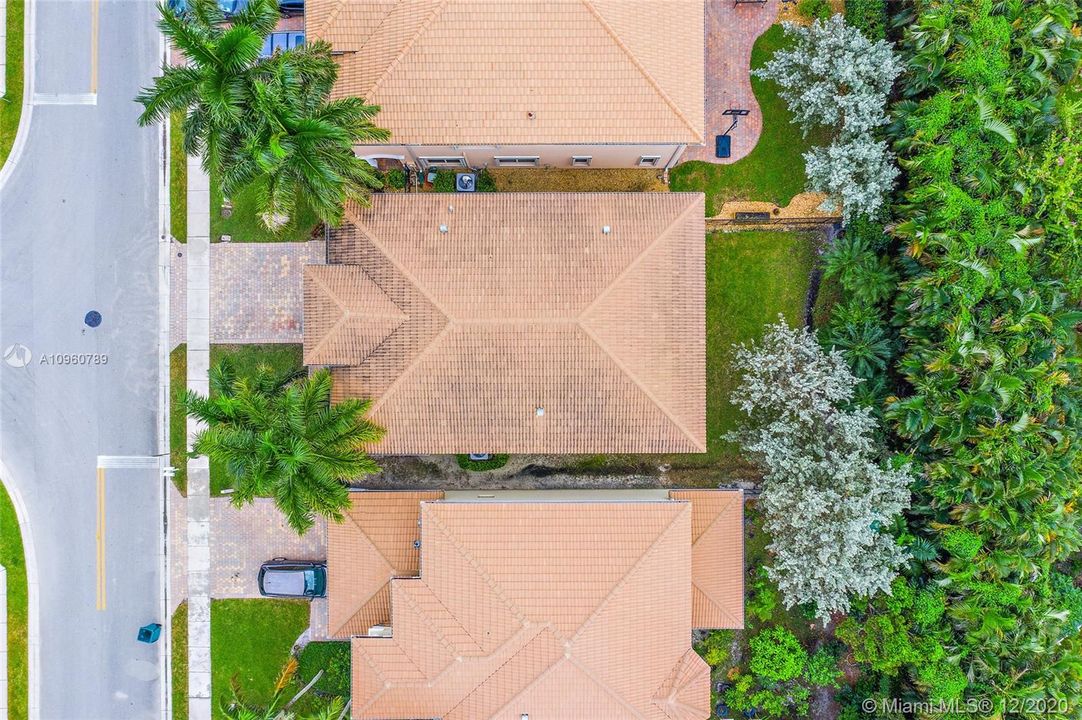 Ariel shows zero lot line with privacy from neighboring community homes.