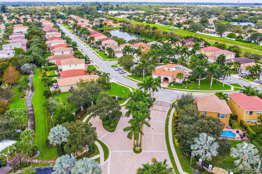 Ariel of gated Knollwood community entrance. Knollwood park entrance to the left. Community pool, gym, tot lot and BBQ area straight ahead.