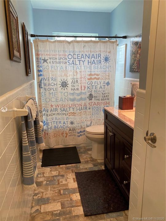 Bathroom 2 with bathtub and linen closet