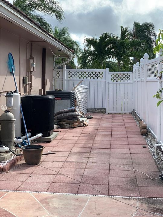Left side behind fence - AC/Pool Pump/Heater/Sprinkler Well tank