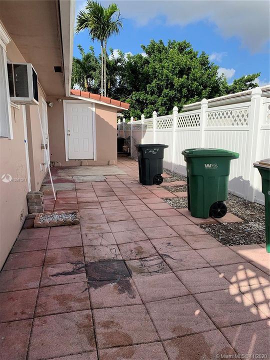 Right side behind fence into side storage room.