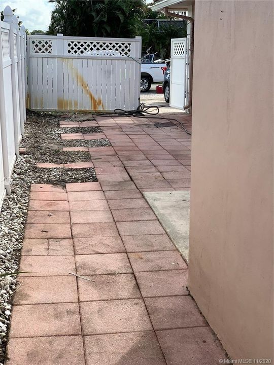 Rear Right view past fence to street