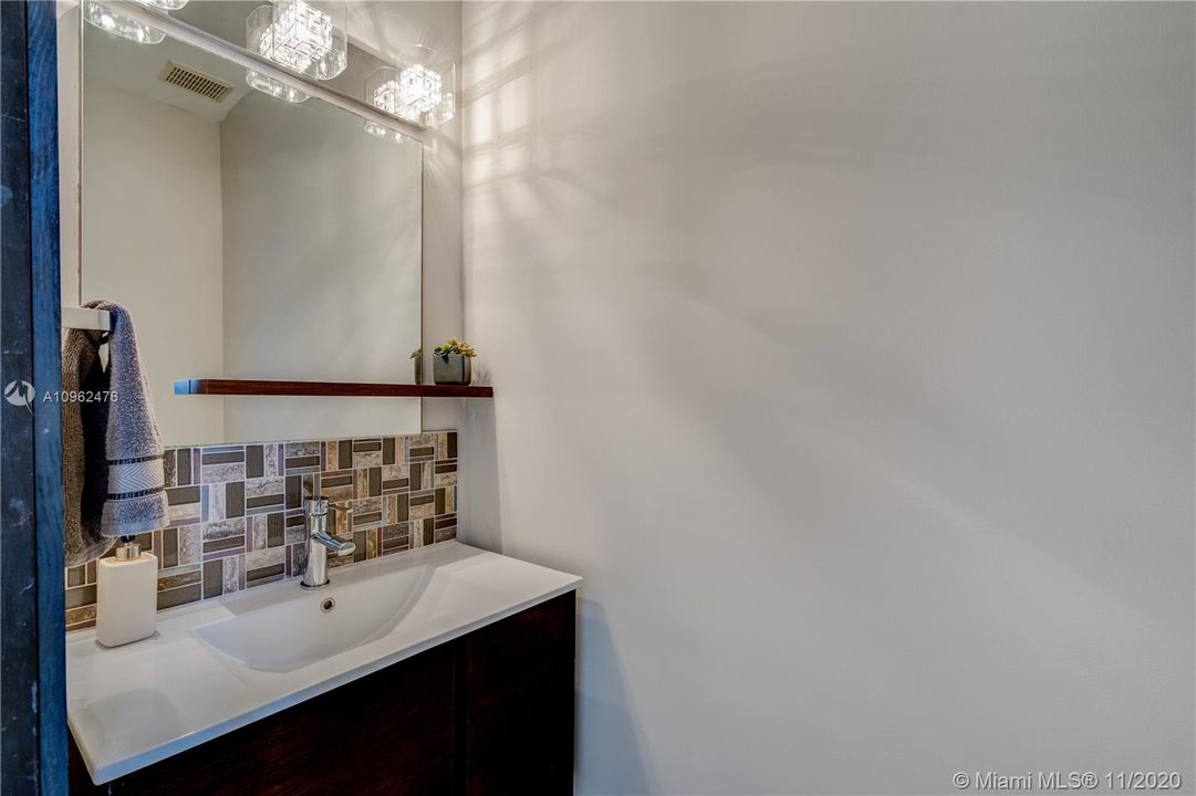 Guest half bath with a modern look