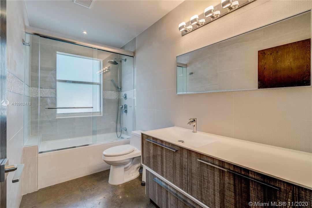 Modern, contemporary bathroom with tub and shower