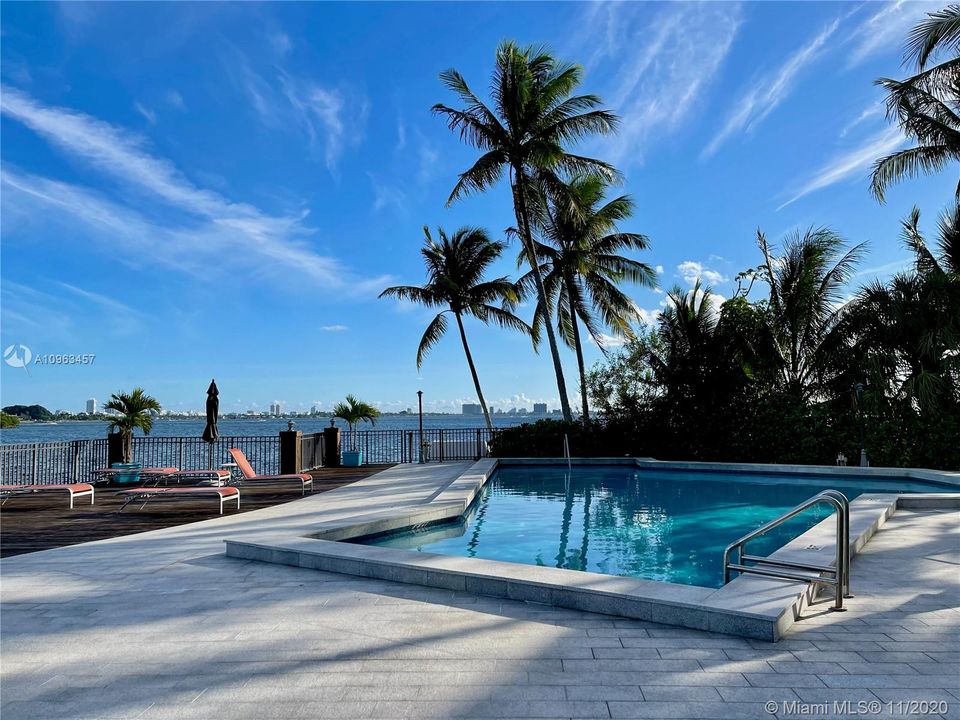 Lounge in or by the heated pool and enjoy the beautiful bayview!