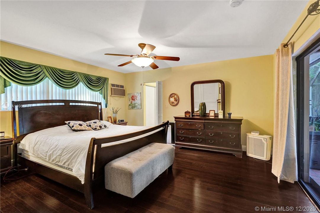 Master bedroom with wood floors