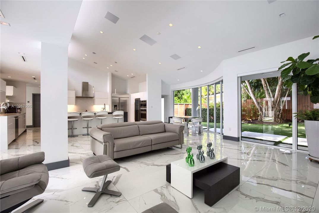 Family room - kitchen surrounded by 12-hole putting green.