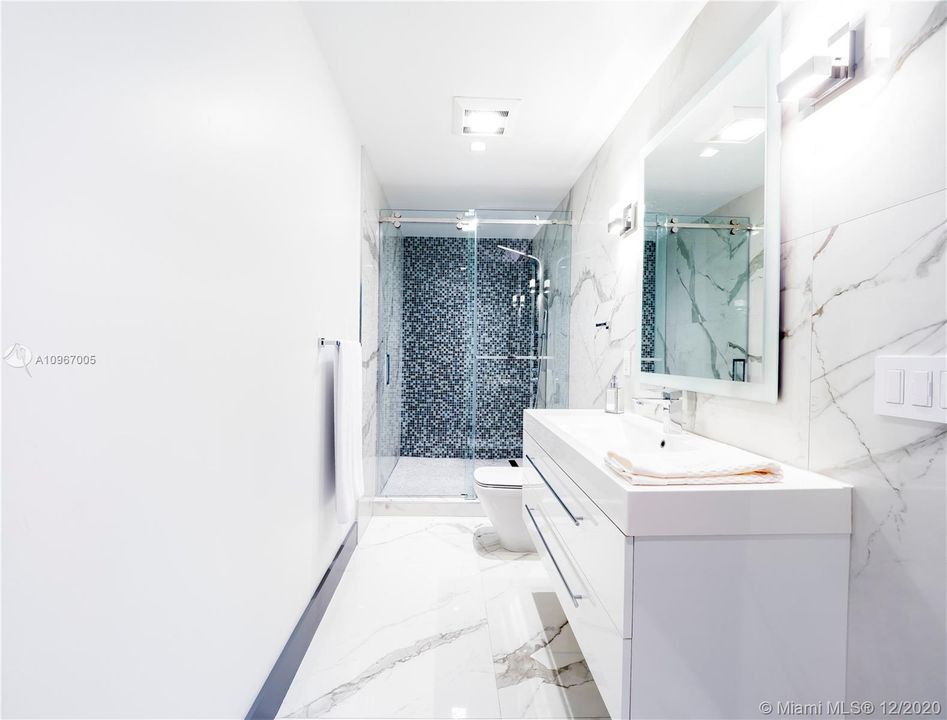 Full bath shared by media room and bedroom #1.