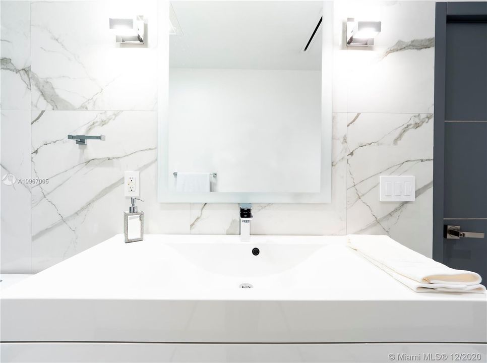 Full bathroom shared by media room and bedroom #1.