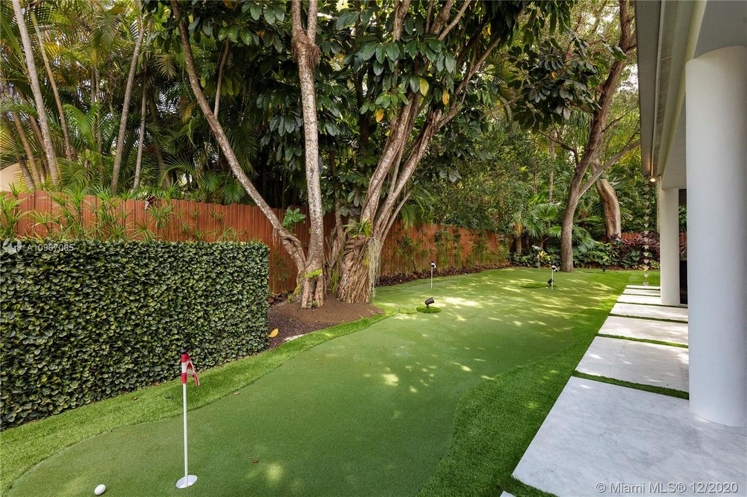 TopPutting - 12 hole green, surrounding perimeter of house. Dura Fence - rich bronze steel, maintenance free.