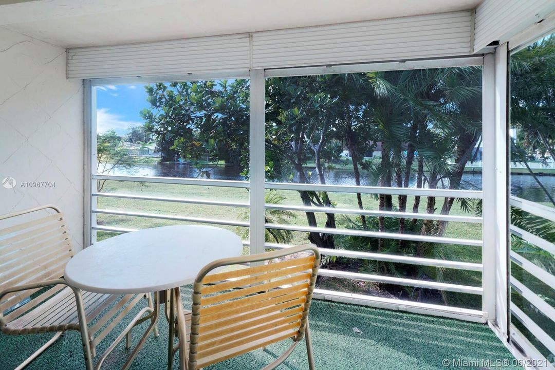 Screened in porch with water views.