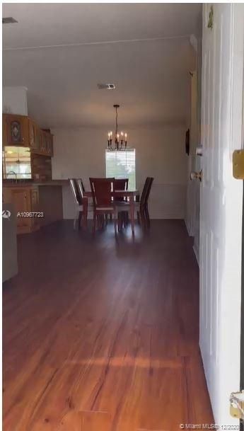 Main entrance, newer vinyl flooring throughout the property.