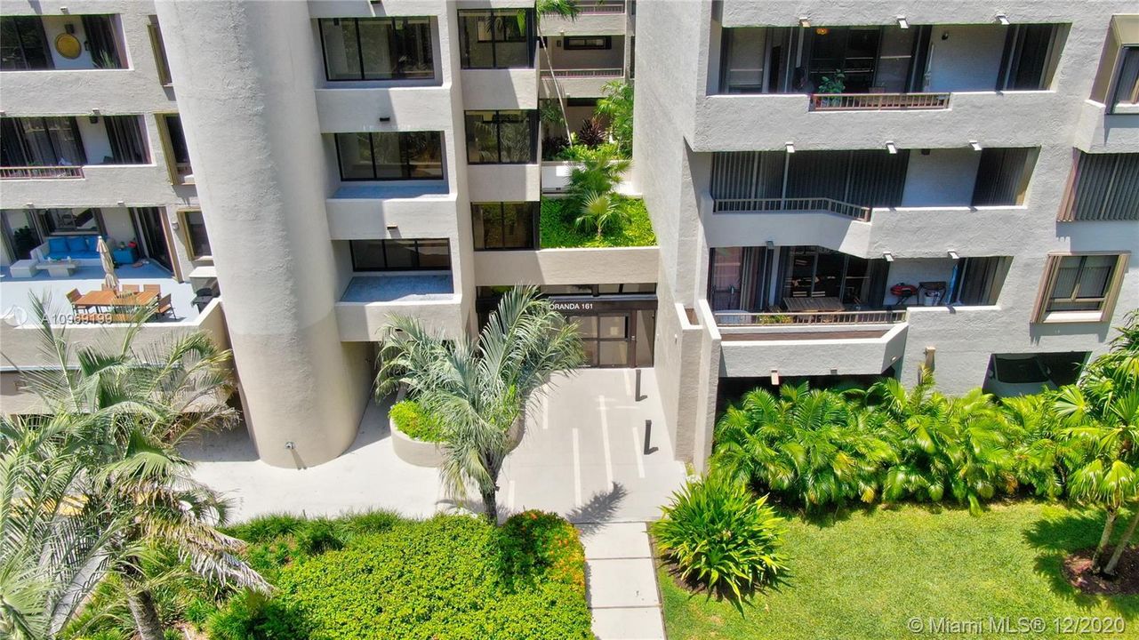 This corner penthouse unit features newly remodeled entrance through the Floranda lobby of Botanica, within the Key Colony community.
