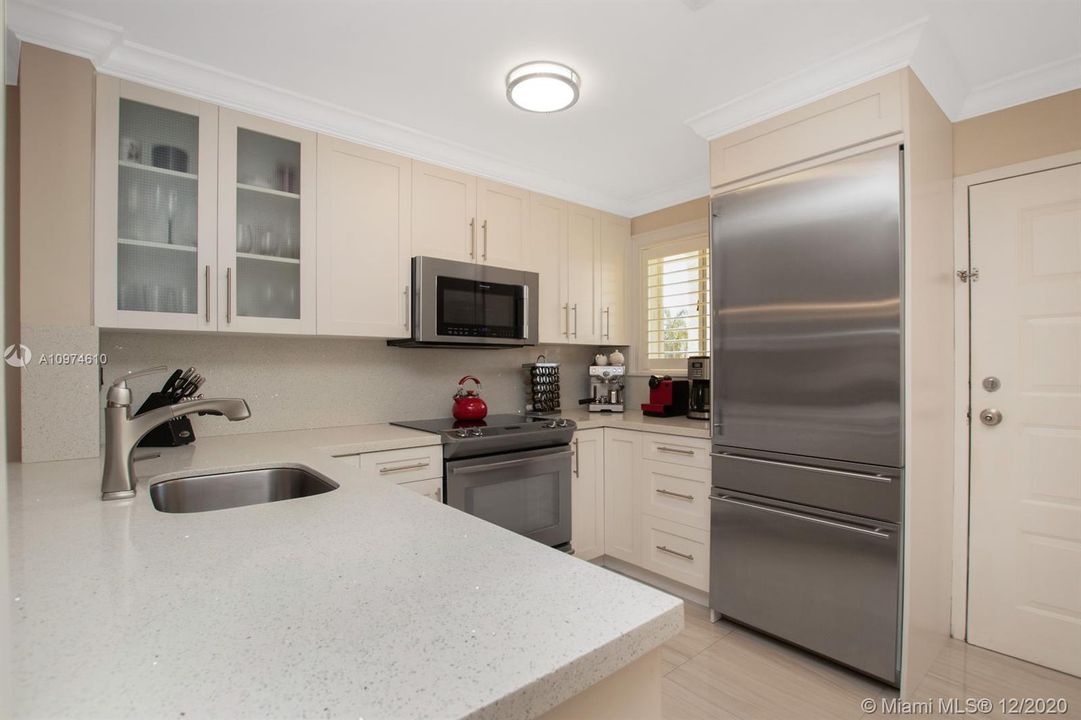 Quartz Counters & Backsplash, Real Wood Cabinetry, High-End Fixtures And Top of The Line Appliances.