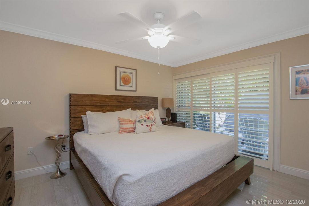 Master suite with a view!  Crown molding, plantation shutters, tile floor carried through to bedrooms.