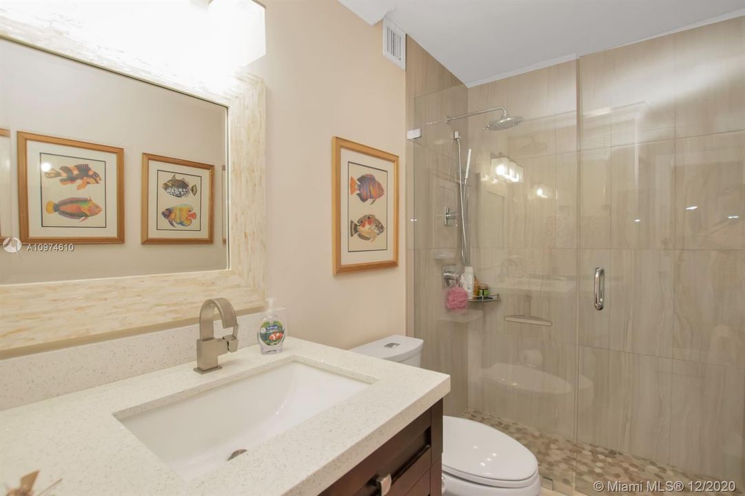 Master bath completely updated.  Look at those fixtures and glass shower doors!