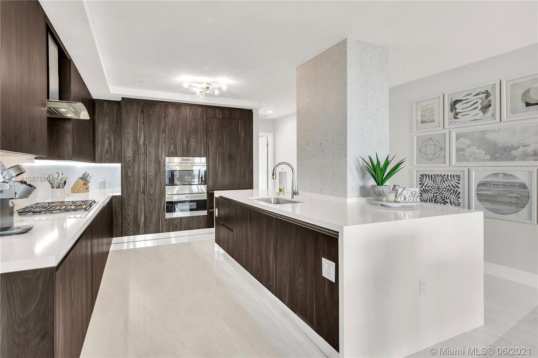 Wolf & Sub-Zero Appliances, Quartz Countertops & Italian Cabinetry.