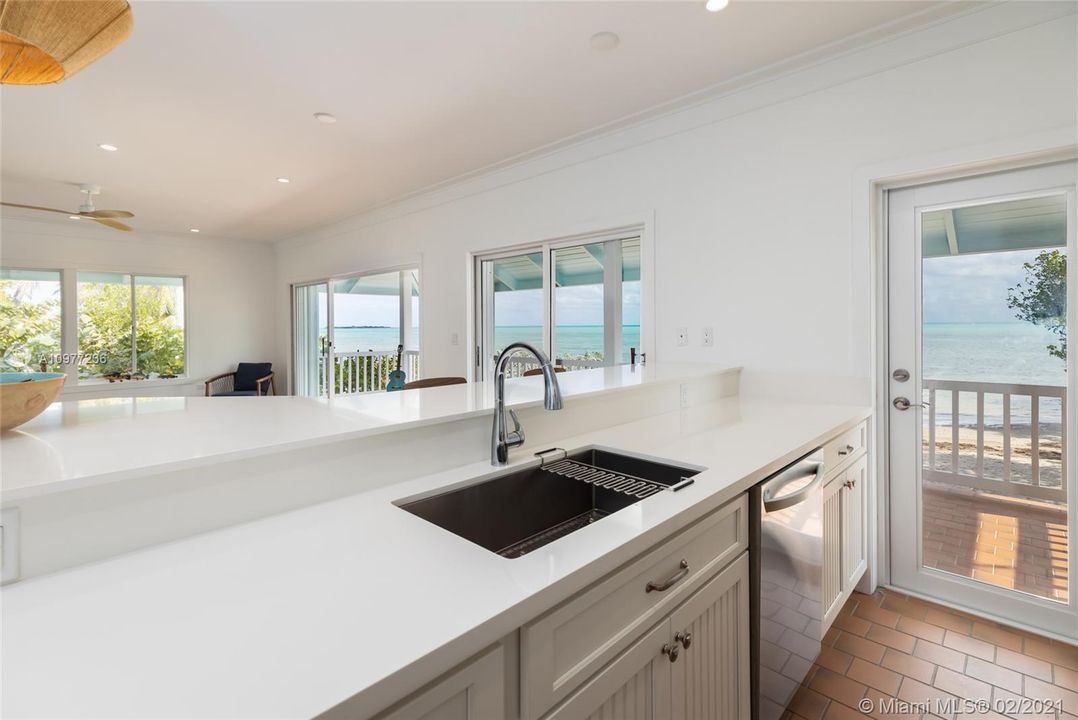 Kitchen: Open and Beautifully updated kitchen offers jaw dropping views as you prepare the Day's catch.