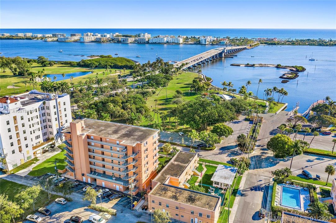 Views of Bryant Park and the Intracoastal Waterway. Bridge to Palm Beach Island. Lake Worth Golf Club on top left. Boat launch on center right. Lower right shows the community pool and community meeting room.