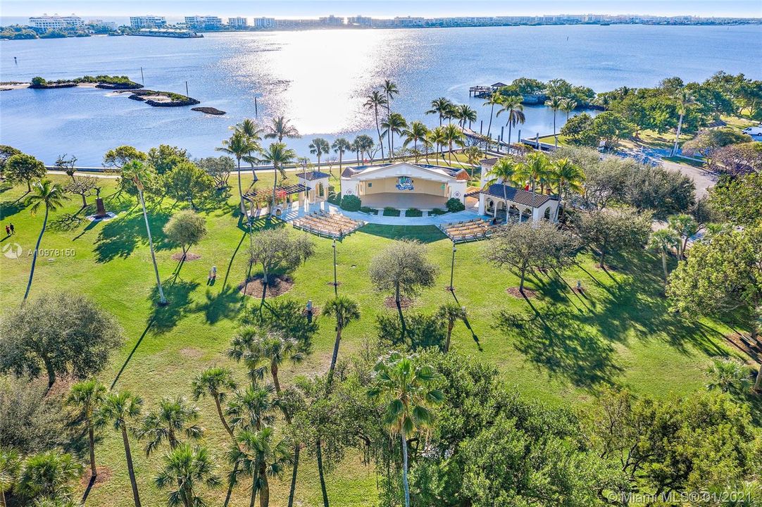 Views of Bryant Park and the Intracoastal Waterway. Bridge to Palm Beach Island. Lake Worth Golf Club on top left. Boat launch on center right. Lower right shows the community pool and community meeting room.