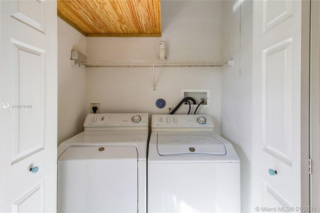 Laundry room closet near kitchen [in the house]