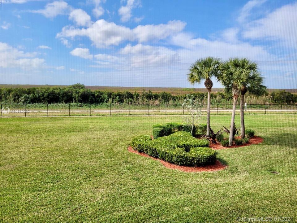 Beautiful backyard, with walk-way between everglades and community.Unit with BEST VIEWS, no buildings blocking the spectacular sunsets.