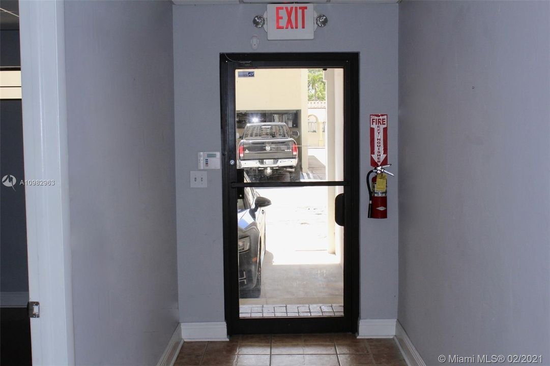 Rear door to covered parking for 3 cars