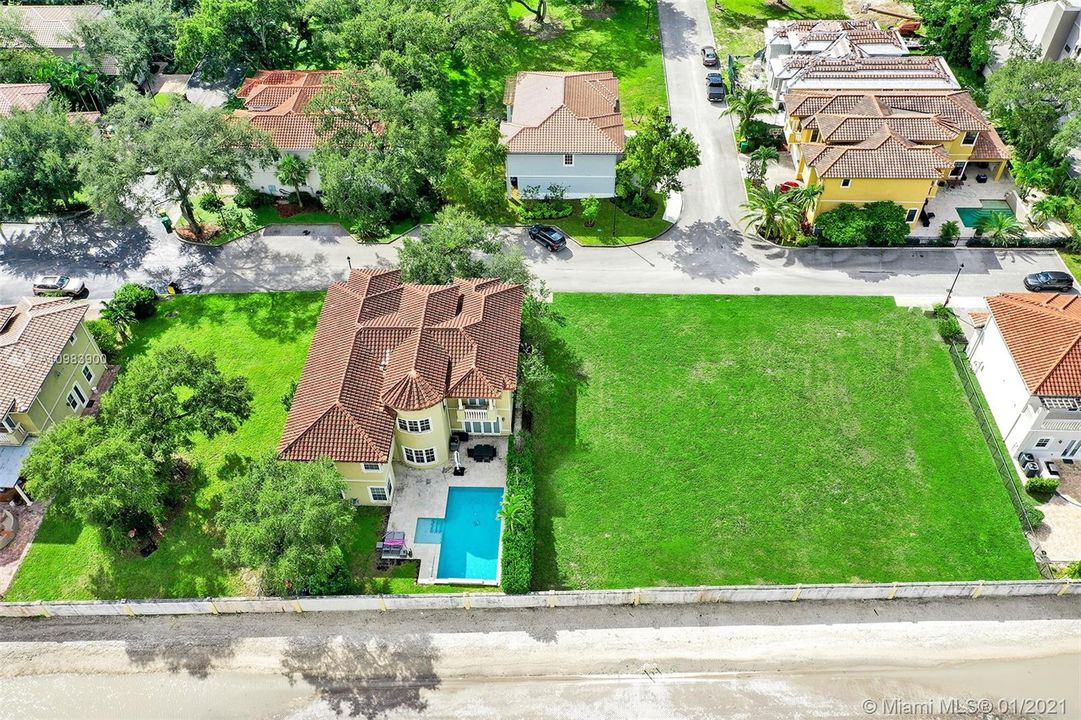 DRONE VIEW OF LOT 22 ON THE LEFT IN BETWEEN 2 PRIOR BUILT HOMES