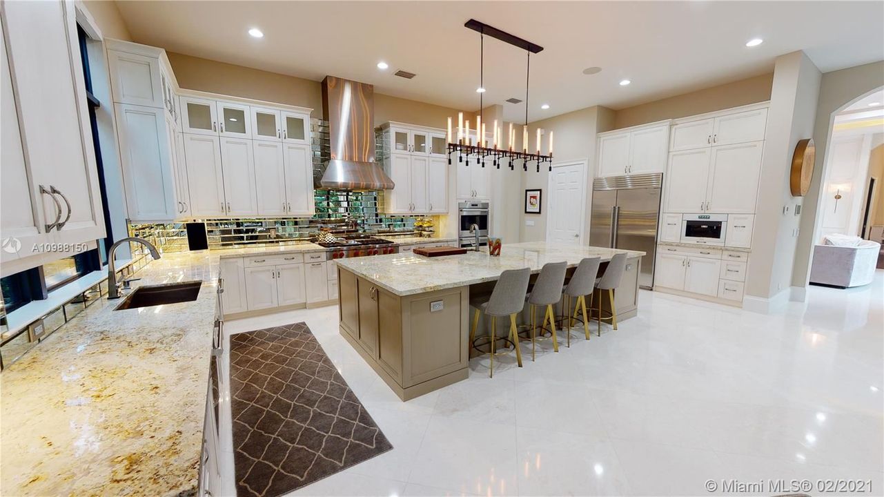 Gourmet Kitchen with Gas Range, double oven, ALL top of the line appliances, refrigerator drawers, built-in coffee maker, large walk-in pantry, GIGANTIC Island