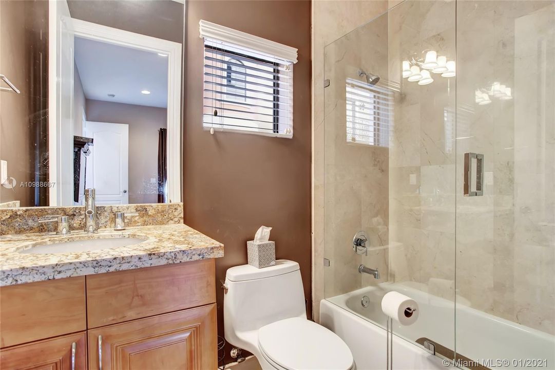 Tastefully upgraded bathroom attached to the 3rd bedroom downstairs.