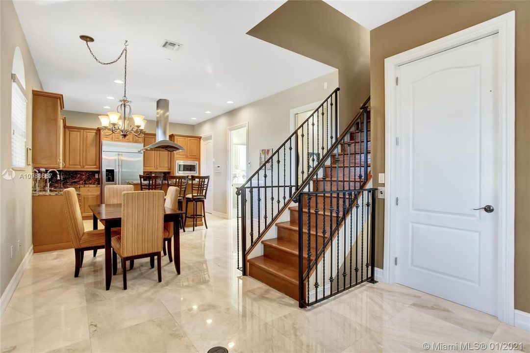 Open Upgraded kitchen concept with island and breakfast bar. Large pantry w/ built-ins, laundry room located on the 2nd floor and 1/2 bathroom. Open kitchen overlooks the dining area and large family room w/ access to the stairs and/or private elevator.