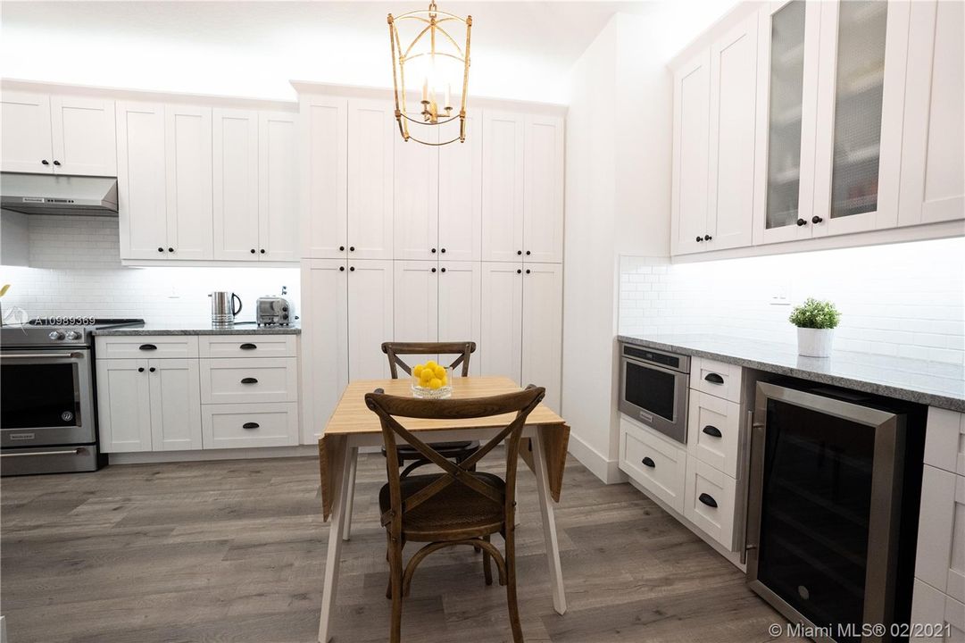 Spacious Breakfast area with beautiful Farmhouse chandelier.