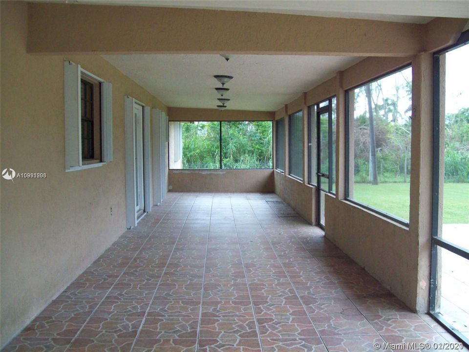 Long and spacious screened back patio