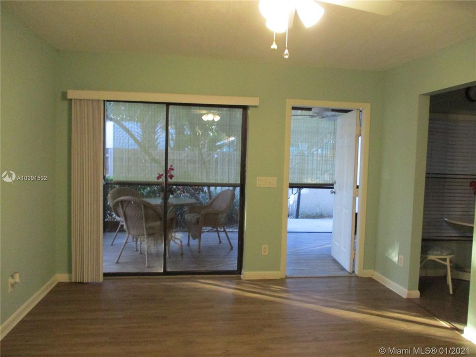 Living room area with sliding glass doors to patio