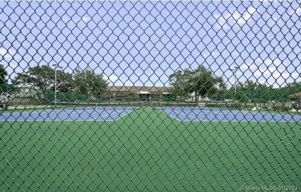 Two tennis courts, lighting available for evening games. Dog park not shown.