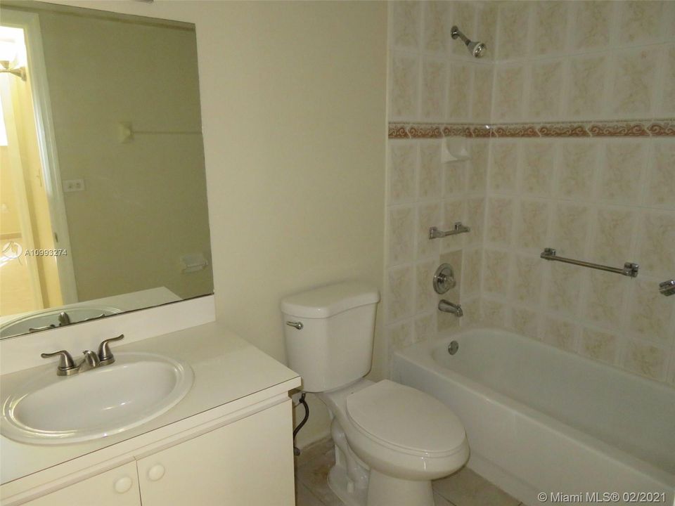 Updated bathroom with new toilet...tankless water heater in a/c closet...