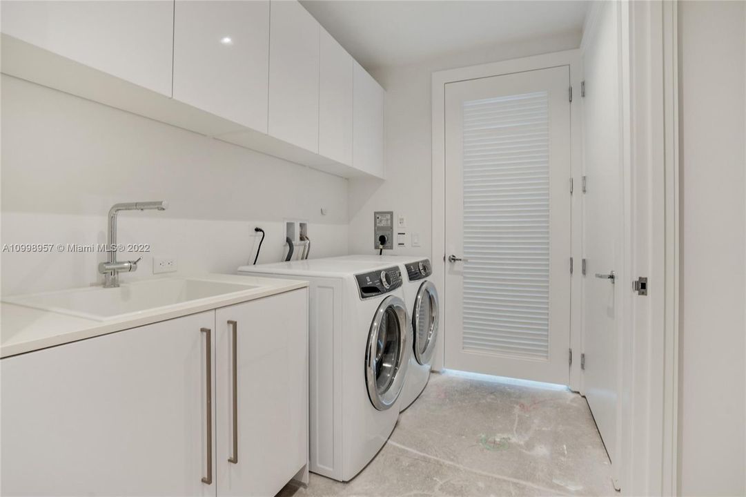 Laundry Room, all white with washer and dryer separated