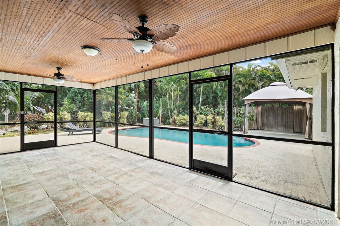 Screened in lanai. Pool area with gazebo covered area.