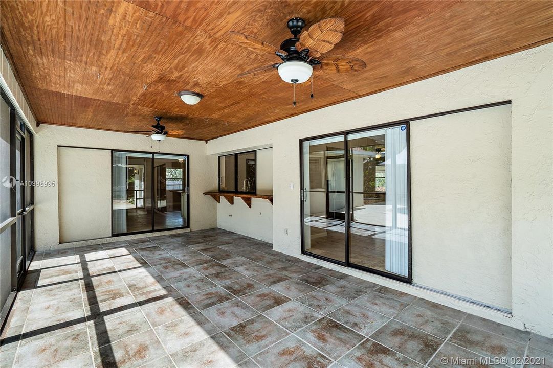 Screened in lanai with pocket sliders to dining room / family room and kitchen.