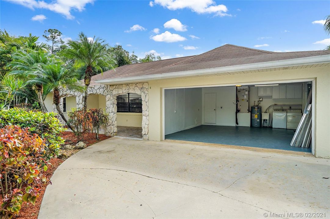 2 car garage with laundry and storage..