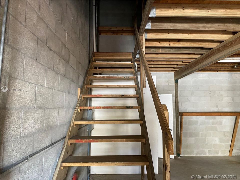 Stairway to second floor loft and storage