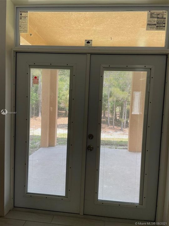 French Doors/Impact exit to Exterior Porch