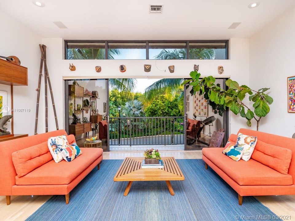 2nd floor living room overlooks the tennis court and beautiful community landscaping & offers high ceilings & a spacious/open feel.