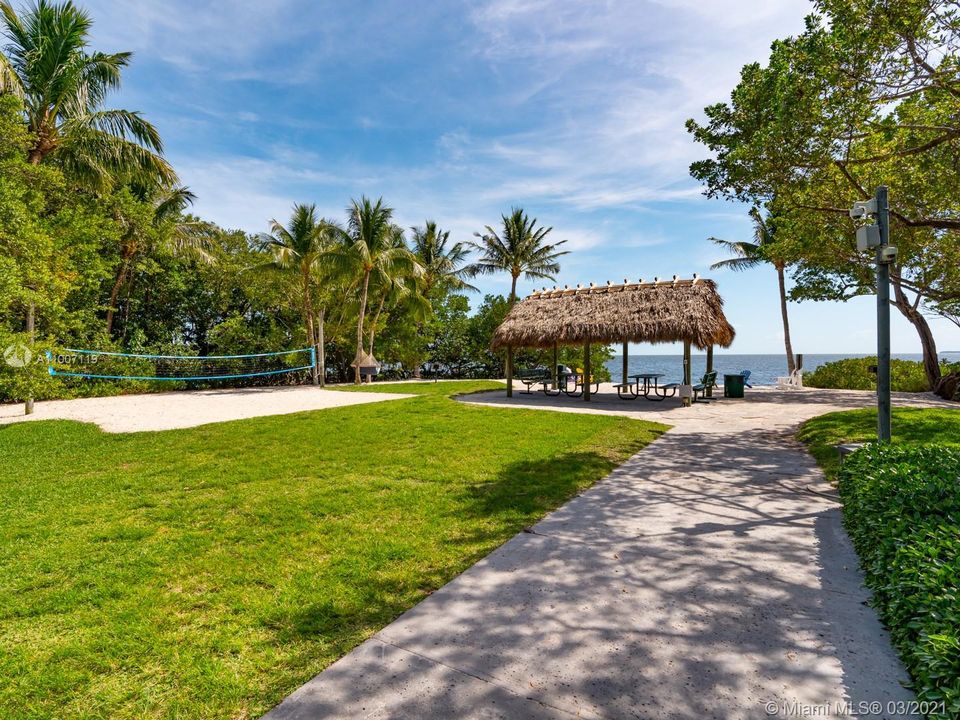 The beach area has a Chickee hut & volleyball court and can be reserved for gatherings - it's an awesome place to host a small socially distanced party (or a larger post-covid gathering!).