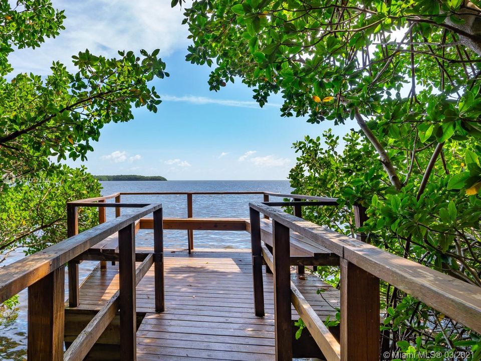 The community maintains a boardwalk in the mangroves that opens to one of the prettiest spots in Biscayne Bay overlooking Chicken Key & the Biscayne Bay National Park in the distance.