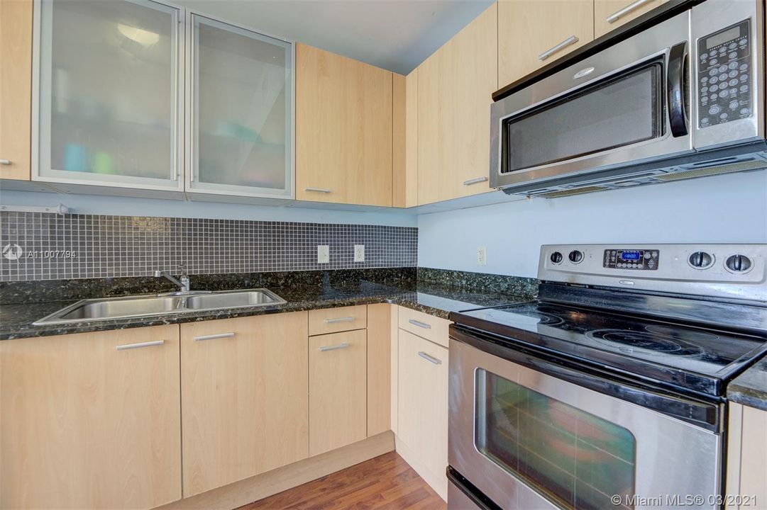 Stainless steel appliances and granite counter tops in all of the kitchens
