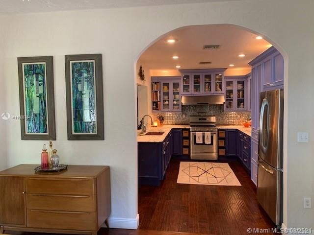 OPEN KITCHEN WITH MARBLE COUNTERS, COPPER SINK, GAS STOVE
