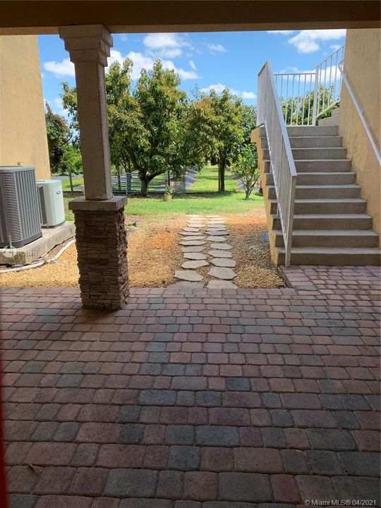 Hallway/Breezeway with Stairs leading to 1/1 guest apartment