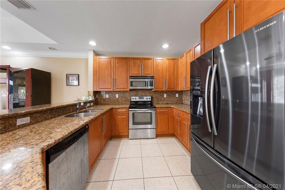 KITCHEN VIEW WITH COUNTER BAR.