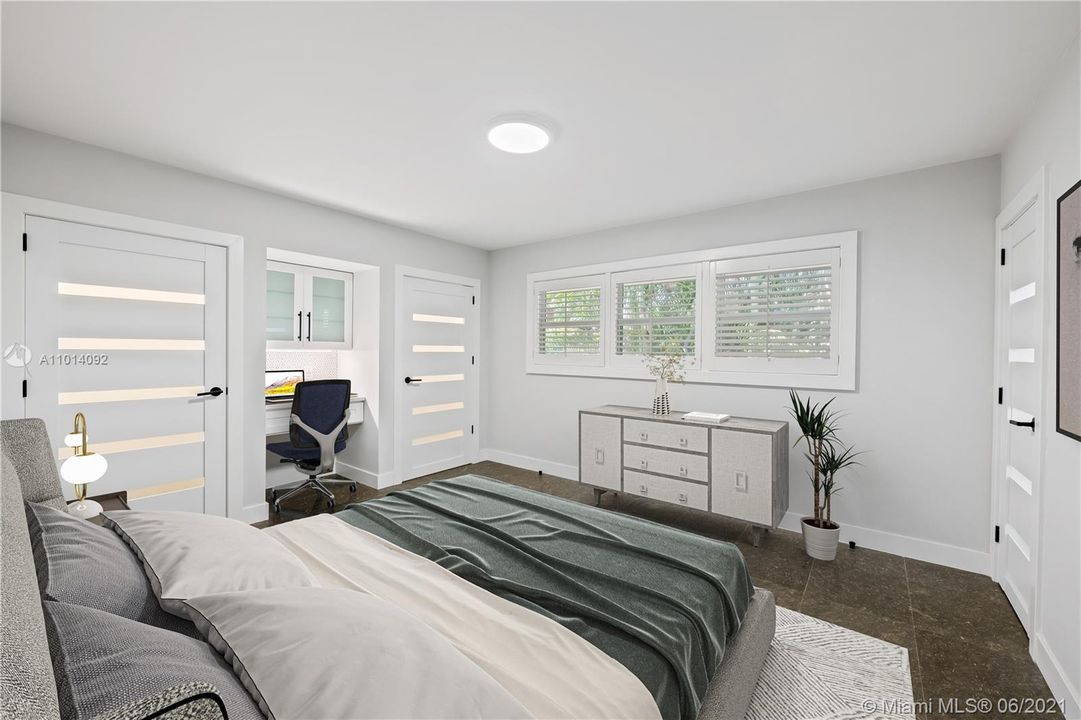 Spacious guest bedroom! Featuring a desk area and each room has its own bathroom.